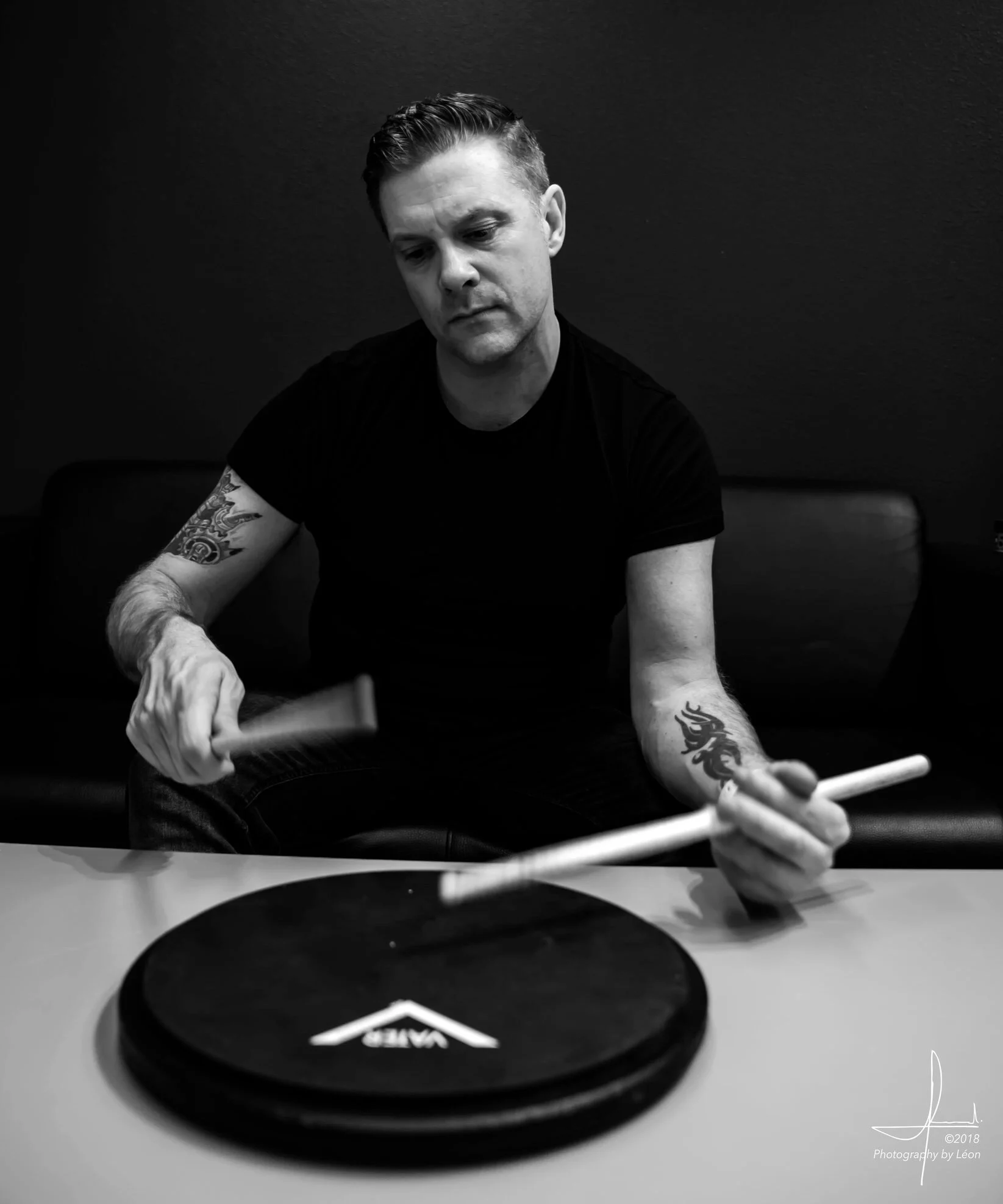 Craig Blundell portrait with drumsticks